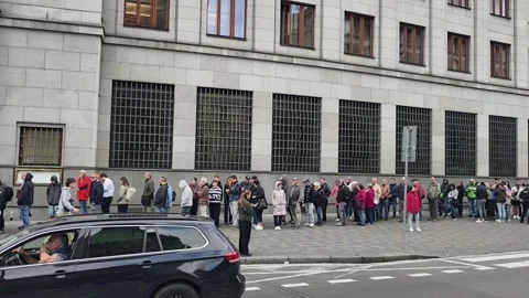 Huge Queue Outside Czech National Bank for Anniversary CZK 5,000 Banknote Video stock 346153712