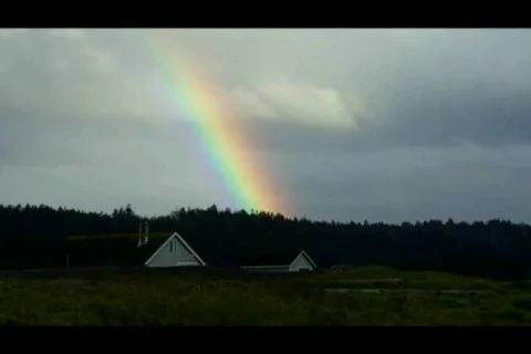 Huge Rainbow with Car Driving By Stock Footage 688950