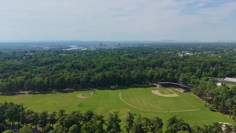 Huge recreation Athletic Field with distant Springfield cityscape, Massachusetts Stock Footage 340185501