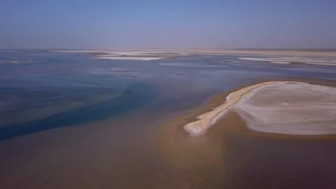Huge river delta with sandy islands and pink flamingo in background Video stock 208937579
