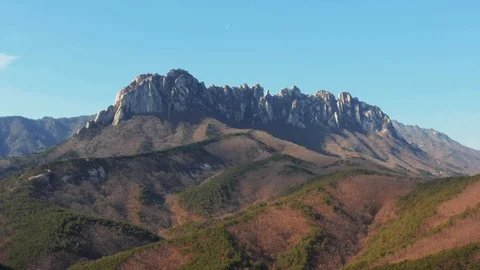 Huge rocky mountain smooth aerial shot in Korea, Seorak mountain, Ulsanbawi Stock Footage 121776053