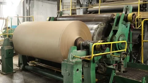 A huge roll at the finish of a paper machine at a paper mill Stock-Footage 169041113