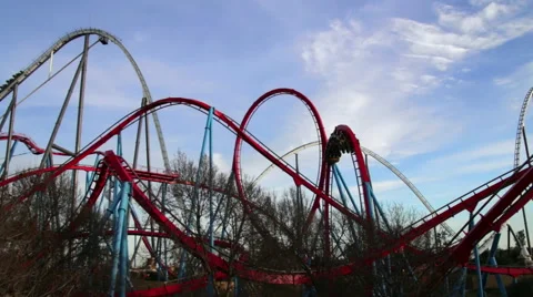 Huge Roller Coasters at an Amusement Park Stock Footage 45526311