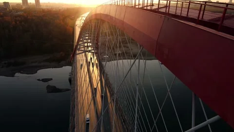 A huge rope bridge against the backdrop of sunset. Road transport Stock Footage 164519045