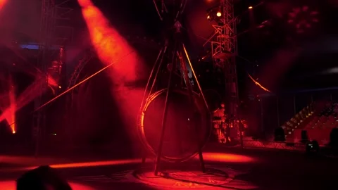 A huge rotating wheel of death, on which acrobats perform in the circus. Stock Footage 310656497