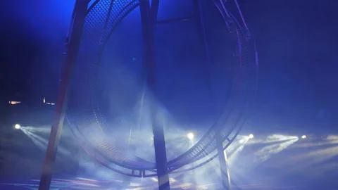 A huge rotating wheel of death, on which acrobats perform in the circus. Stock Footage 311151552