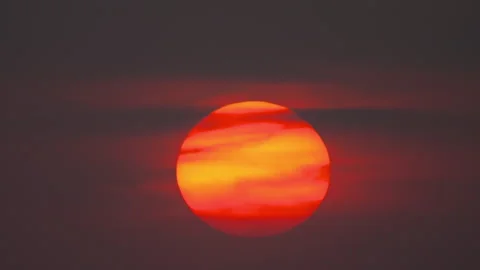 Huge round red sun in the sky, sunset Stock Footage 291575510