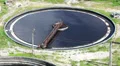 Huge round tanks for waste water treatment with sewage. Industrial factory HD Footage