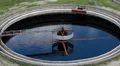 Huge round tanks for waste water treatment with half fulled HD Footage