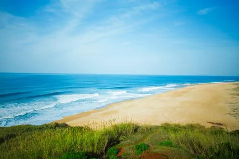 Huge sandy beach with big waves Stock Photos