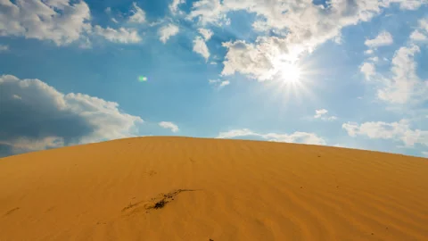 Huge sandy dune under a sparkle sun Stockbeeldmateriaal 334837045