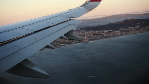 Huge seaport view from aircraft window. Amazing sight outside of modern plane. Stock Footage 106724403