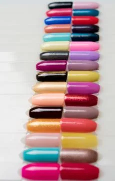 Huge selection of bright varnish on the sample Stock Photos
