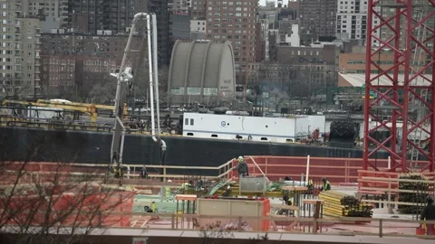 Huge ship passing new construction in New York Stock Footage 241451364