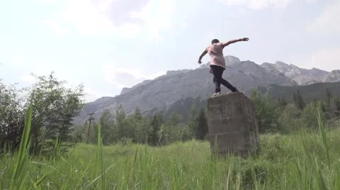 Huge Slow Motion Backflip off of Ruins in Wilderness Stock Footage 52447829