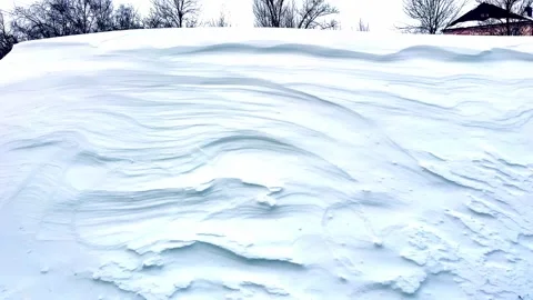 A huge snowdrift after a snowstorm in yard of residential buildings in city in Stock Footage 263289997