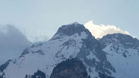 Huge snowy mountain dominating the Alps in winter, in Switzerland Stock Footage 239722017