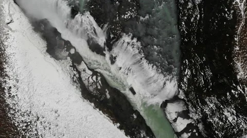 Huge snowy waterfall drone view Stock Footage 233605099