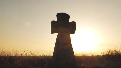 Huge stone cross against the sunset Stock Footage 103217982