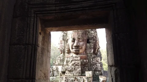 Huge stone faces on the towers of the ancient temple. Bayon. Angkor. Cambodia Stock Footage 107281994