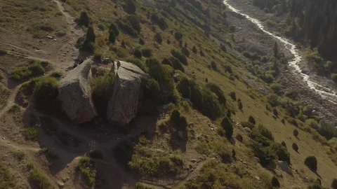 A huge stone, forked in two. The tourist parking lot is a Broken Heart Video stock 259791537