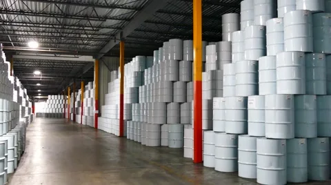 Huge storage facility filled with white barrels with lift truck Stock Footage 45869710