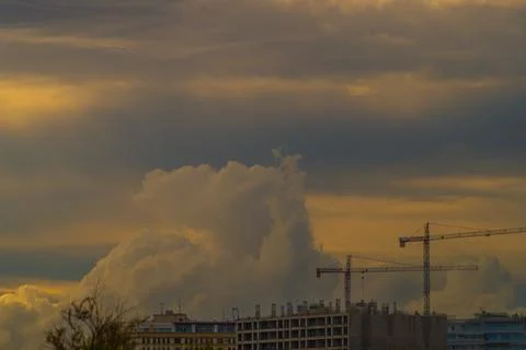 Huge storm clouds are approaching the city from the side of new buildings wit Fotos de archivo
