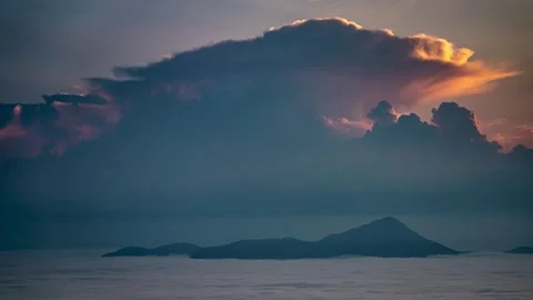 Huge Storm Clouds Forming Over Foggy Mountains at Sunrise Time Lapse Stock Footage 317248677