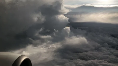 Huge storm of clouds next to a moving aircraft, window perspective shot Stock Footage 115922557
