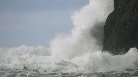 Huge storm waves weather pacific ocean hitting crashing into cliff rock Stock Footage 122804660