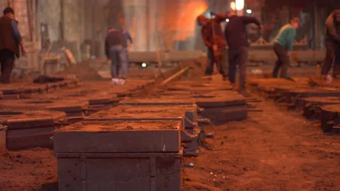 The Huge Stream of Hot Liquid Yellow Metal is Pouring to the Compression. Stock Footage 172501571