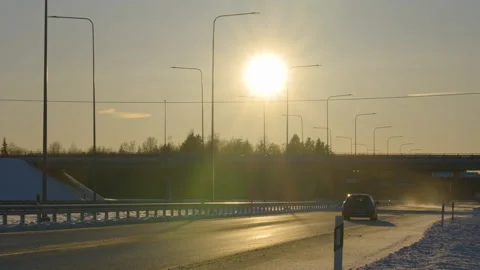 The huge sun setting on the sky in the city Stock Footage 151375556