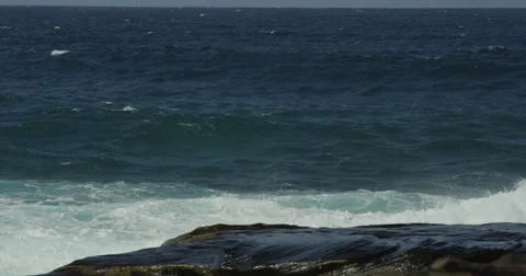 Huge Surf Breaking on Rocks 2k Stock Footage 37882982
