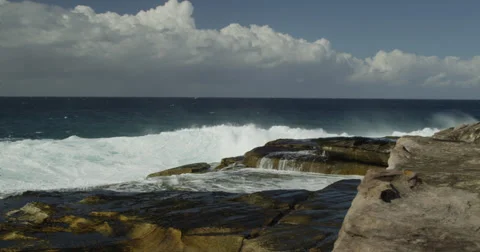 Huge Surf Breaking on Rocks 2k Stock Footage 37923994