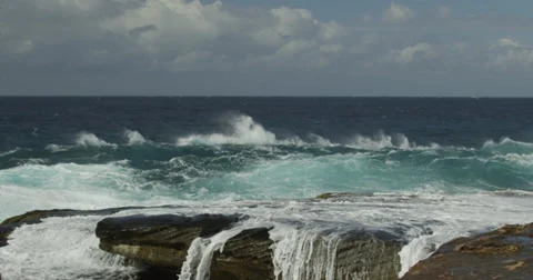 Huge Surf Breaking on Rocks 2k Stock Footage 37988276
