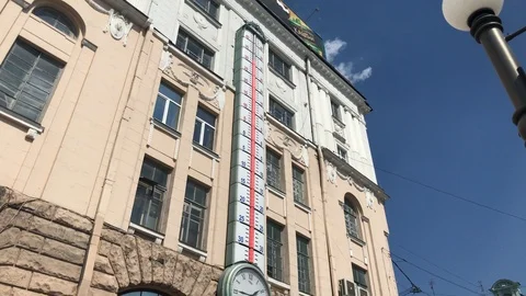 Huge thermometer during summer shows above 30 degrees temperature. Hot weather Stock Footage 93780280