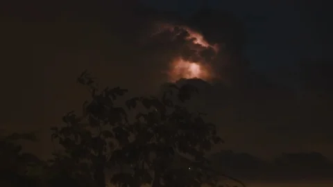 Huge Thunderstorm Cloud with lighting spark (flash) inside on a cloudy night  Stock Footage 107432434