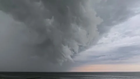 A huge thunderstorm cloud is moving over the sea. Stock Footage 314786539