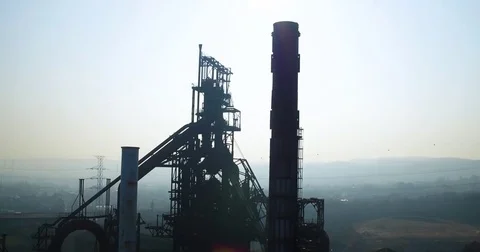 Huge tower and chimneys at an old steel factory against a foggy background Stock Footage 81534687