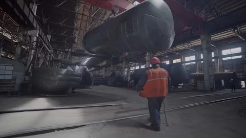 A Huge train wagon is being transported by the industrial crane at the factory Stock Footage 220896168