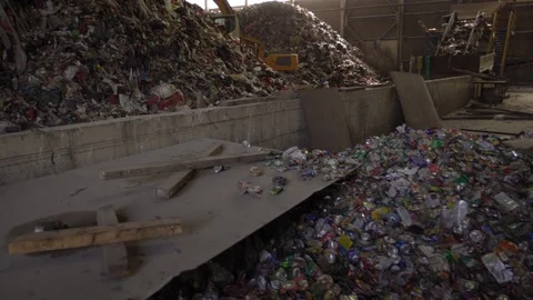 Huge trash dump processing factory with a lot of plastic and other human created Stock-Footage 120805041