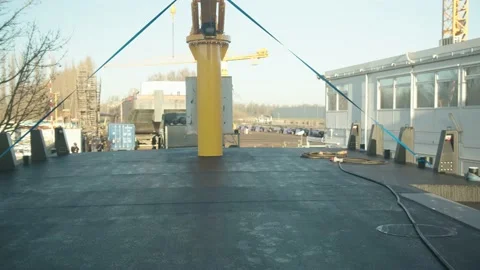 Huge truck with flat bed trailer transporting huge boat into shipyard Stock Footage 206286981
