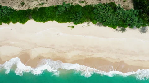Huge turquoise waves breaking slowly on lonely sandy beach on Sri Lanka island n Stock Footage 331759352