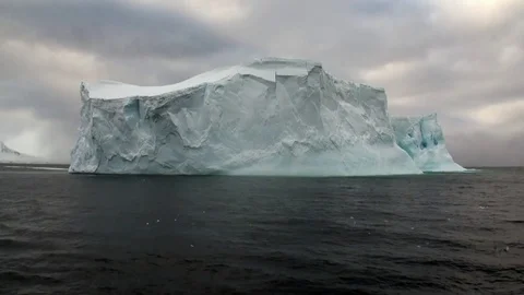 Huge unique glacier iceberg in ocean of Antarctica. Stock Footage
