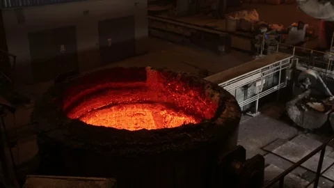Huge vessels with hot red iron in the mettalurgic factory, close-up Stock Footage 72762264