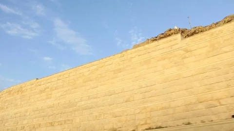 Huge walls and mountains shot through window of moving car. Stock Footage 75993003