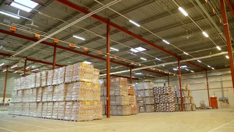 Huge Warehouse With Lots Of Pallets Stock Footage 129398904