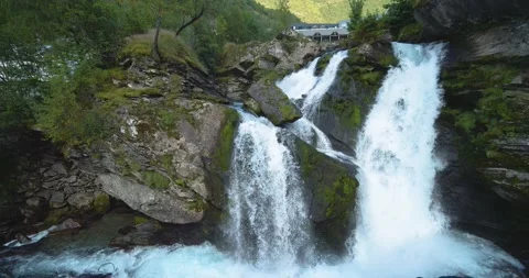 Huge waterfall in front of a building Stock Footage 210536971