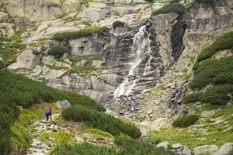 Huge waterfall in mountains Stock Photos
