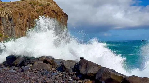 A huge wave crashed against large coastal stones. Portugal. Stock Footage 304583933